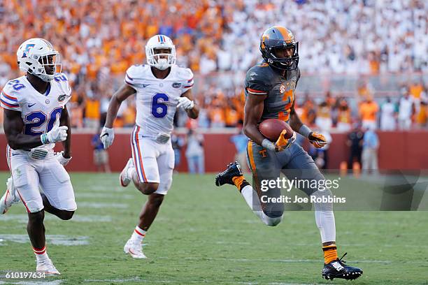 Josh Malone of the Tennessee Volunteers runs into the end zone with a 42-yard touchdown reception against the Florida Gators in the fourth quarter at...