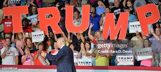 Republican presidential nominee Donald Trump acknowledges supporters' cheers during a campaign event at the Berglund Center on September 24, 2016 in...