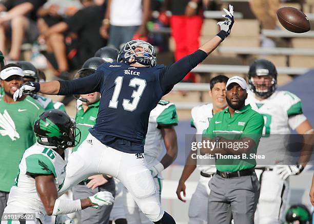 Wide receiver Nate German of the Rice Owls drops the pass against defensive back Chad Davis of the North Texas Mean Green in the first half at Rice...