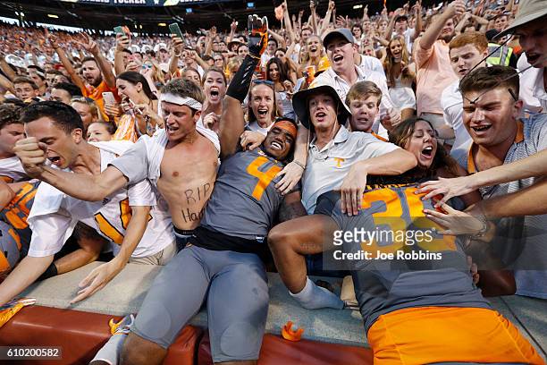 LaTroy Lewis of the Tennessee Volunteers celebrates with fans after the Vols defeated the Florida Gators 38-28 at Neyland Stadium on September 24,...