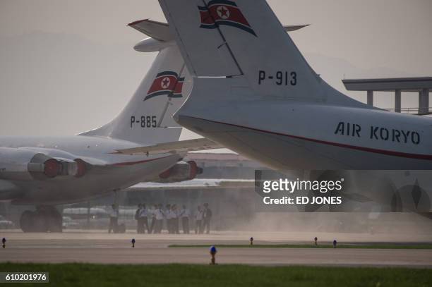 This photo taken on September 24, 2016 shows an Ilyushin Il-72 taxiing past an Ilyushin Il-62 during the first Wonsan Friendship Air Festival in...