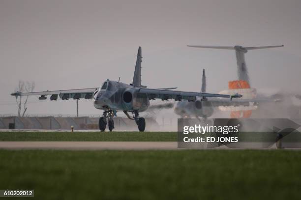 This photo taken on September 24, 2016 shows a Sukhoi SU-25 aircraft landing during the first Wonsan Friendship Air Festival in Wonsan. Just weeks...
