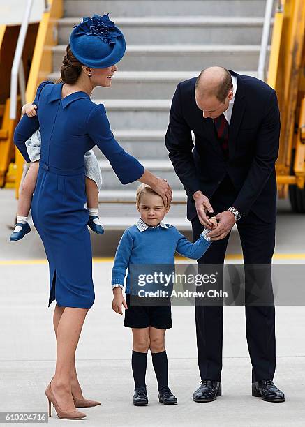 Catherine, Duchess of Cambridge, Prince George of Cambridge and Prince William, Duke of Cambridge arrive at 443 Maritime Helicopter Squadron on...