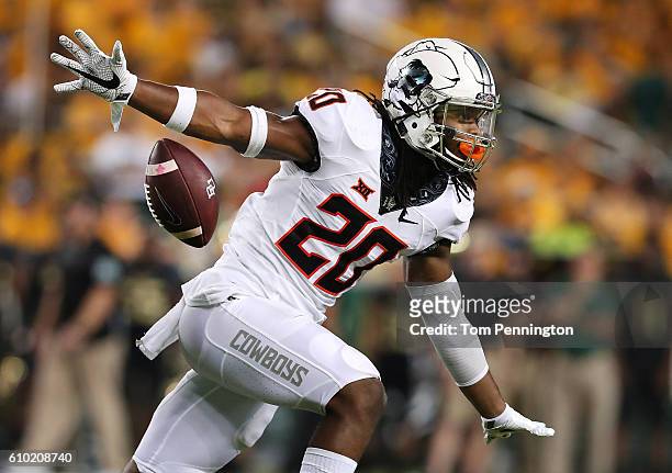 Jordan Burton of the Oklahoma State Cowboys celebrates after recovering a fumble against the Baylor Bears in the first half at McLane Stadium on...