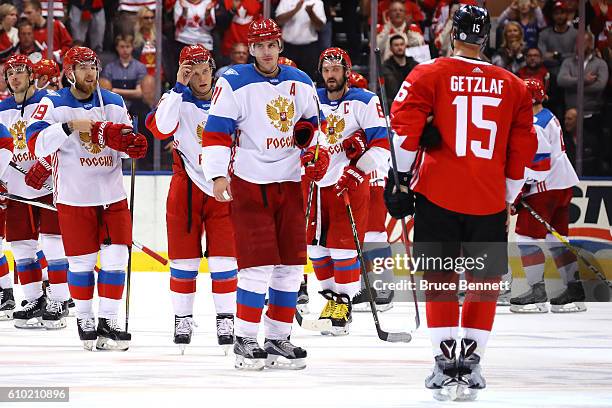 Evgeni Malkin of Team Russia goes to shake the hand of Ryan Getzlaf of Team Canada after his teams defeat at the semifinal game during the World Cup...