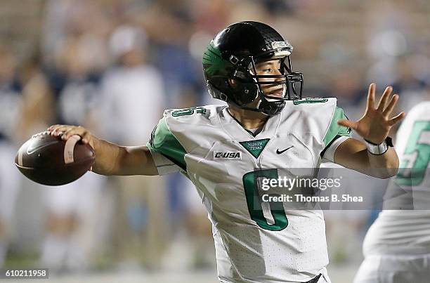 Quarterback Mason Fine of the North Texas Mean Green in the pocket agains the Rice Owls in the second half at Rice Stadium on September 24, 2016 in...