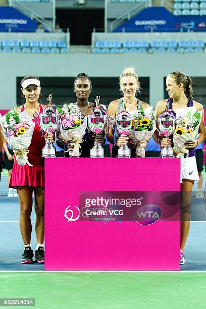 Peng Shuai of China and Asia Muhammad of the US pose with Vera Lapko and Olga Govortsova of Belarus after winning the doubles final match on Day 6 of...