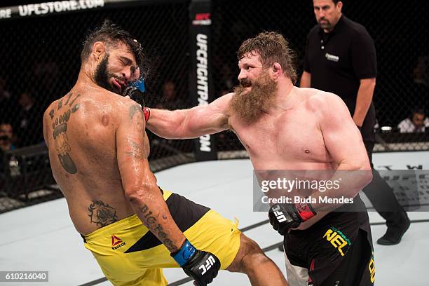 Roy Nelson of the United States punches Antonio Silva of Brazil in their heavyweight UFC bout during the UFC Fight Night event at Nilson Nelson...