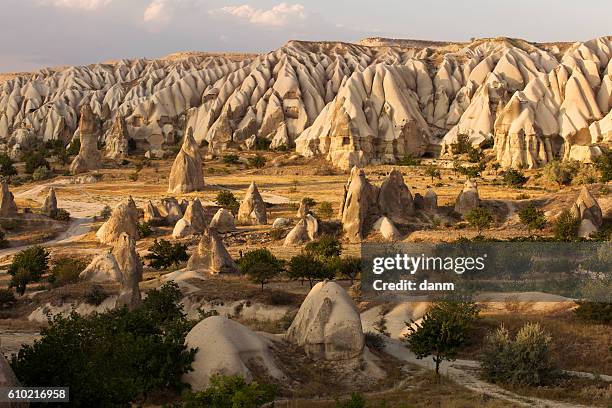 fairy tale landscape chimney rocks valley of cappadocia, turkey - cappadocia stock pictures, royalty-free photos & images