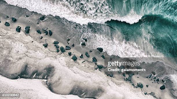 rocky shore - rocks stockfoto's en -beelden