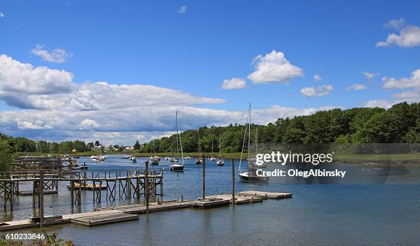 harbor view, pier and moored sailboats in kennebunkport, maine, usa. - kennebunkport stock pictures, royalty-free photos & images
