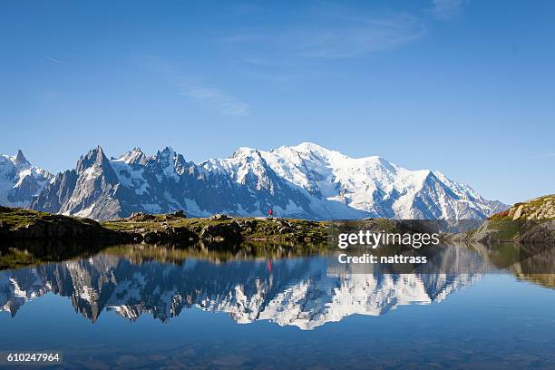 male athlete enjoys a run in the french alps - massif du mont blanc stock pictures, royalty-free photos & images