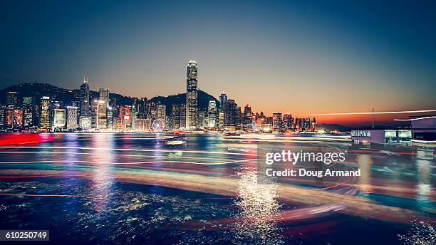 view of hong kong island at night - victoria hong kong stock pictures, royalty-free photos & images