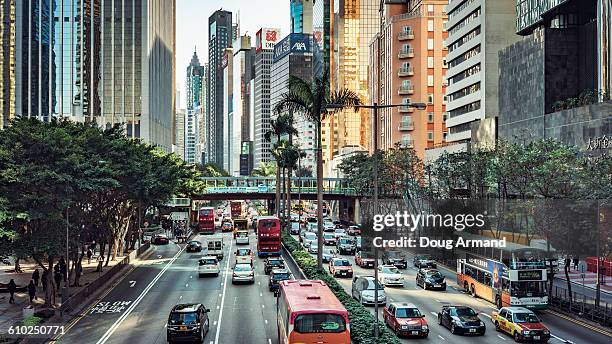 traffic along gloucester road, hong kong island - gloucester road stock pictures, royalty-free photos & images
