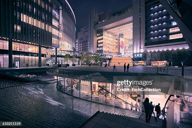 illuminated osaka station area in japan - kita ku osaka stock pictures, royalty-free photos & images
