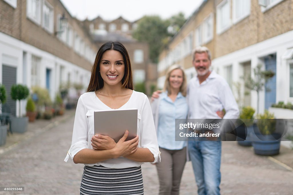 Real estate agent with clients