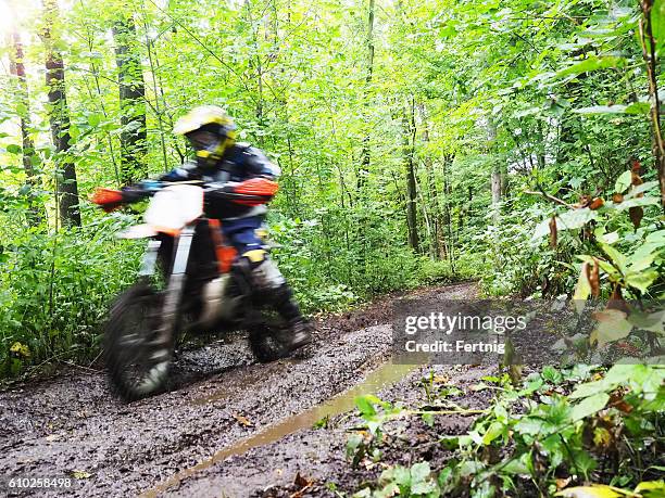 dirt biking in the woods - trail ride stock pictures, royalty-free photos & images