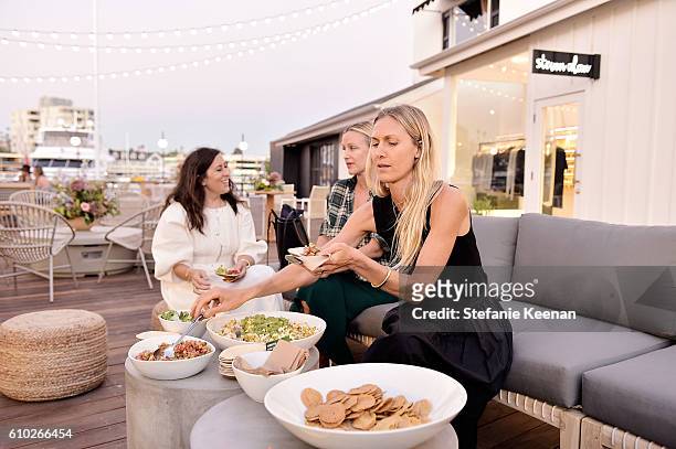Clare Vivier, Ali Taekman and Jessica De Ruiter attend Jenni Kayne and Clare Vivier celebrate the opening of their stores at Lido Marina Village in...