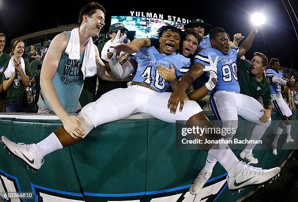 Zachery Harris of the Tulane Green Wave and Robert Kennedy celebrate after a game against the Louisiana-Lafayette Ragin Cajuns at Yulman Stadium on...