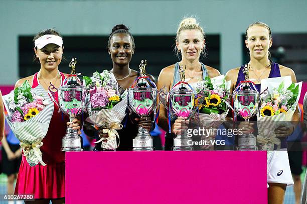 Peng Shuai of China and Asia Muhammad of the US pose with Vera Lapko and Olga Govortsova of Belarus after winning the doubles final match on Day 6 of...