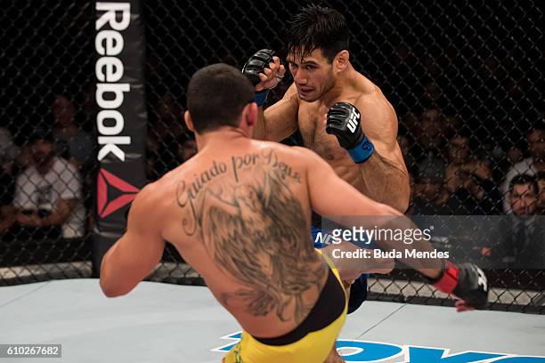 Renan Barao of Brazil kicks Phillipe Nover of the United States in their flyyweight UFC bout during tthe UFC Fight Night event at Nilson Nelson...