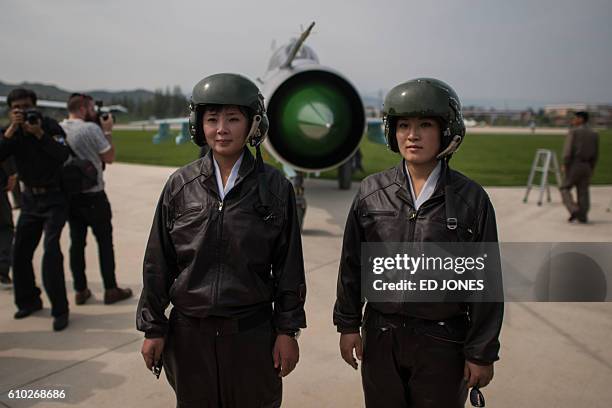 North Korean pilots Jo Kyum-Hyang and Rim Sol , known in North Korea as the 'Flowers of Sky', pose for photos during the second day of the Wonsan...