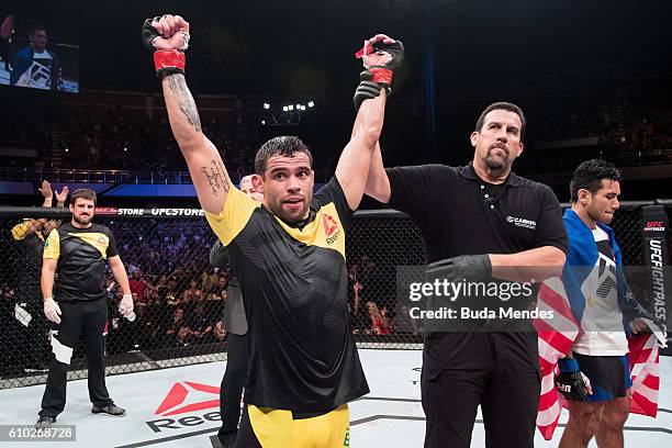 Renan Barao of Brazil celebrates victory over Phillipe Nover of the United States in their flyyweight UFC bout during the UFC Fight Night event at...