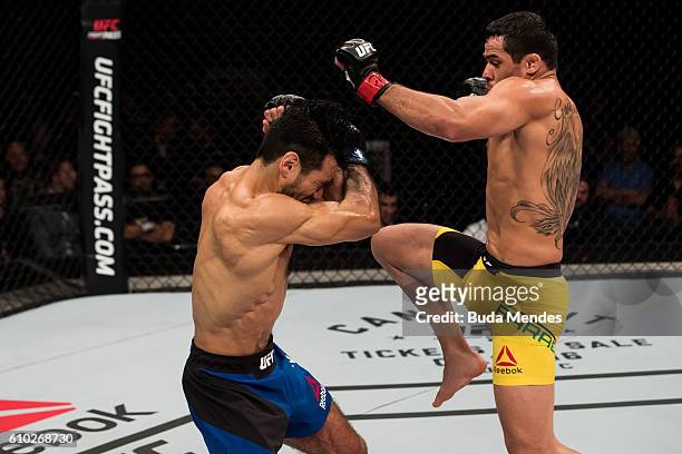 Renan Barao of Brazil kicks Phillipe Nover of the United States in their flyyweight UFC bout during tthe UFC Fight Night event at Nilson Nelson...