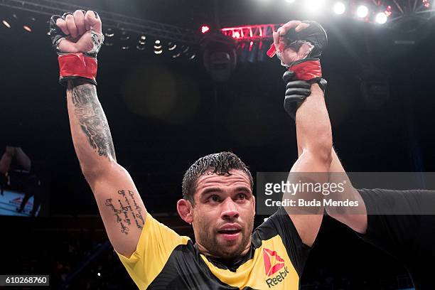 Renan Barao of Brazil celebrates victory over Phillipe Nover of the United States in their flyyweight UFC bout during the UFC Fight Night event at...