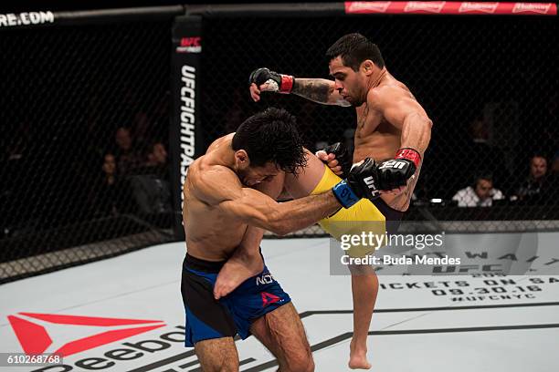 Renan Barao of Brazil kicks Phillipe Nover of the United States in their flyyweight UFC bout during tthe UFC Fight Night event at Nilson Nelson...