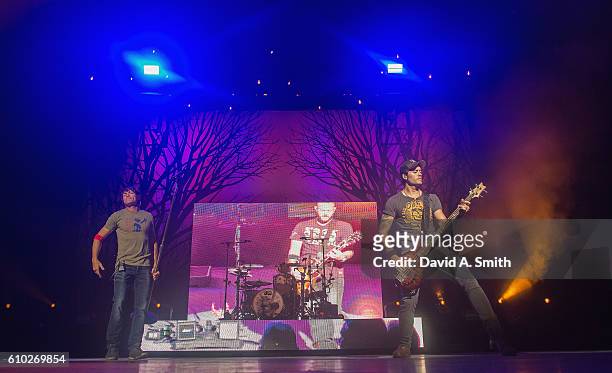 Brad Arnold, Greg Upchurch, and Justin Biltonen of 3 Doors Down perform at Birmingham-Jefferson Civic Center on September 24, 2016 in Birmingham,...
