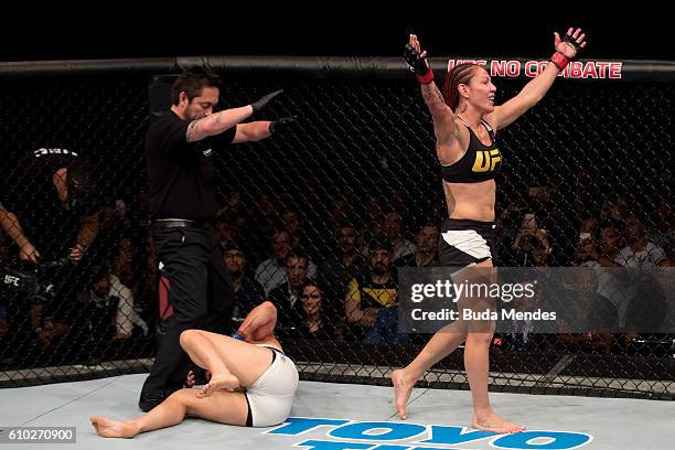 Cris Cyborg of Brazil celebrates victory over Lina Lansberg of Sweden in their catchweight UFC bout during the UFC Fight Night event at Nilson Nelson...