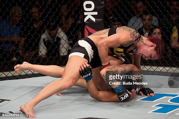 Cris Cyborg of Brazil submits Lina Lansberg of Sweden in their catchweight bout during the UFC Fight Night event at Nilson Nelson gymnasium on...