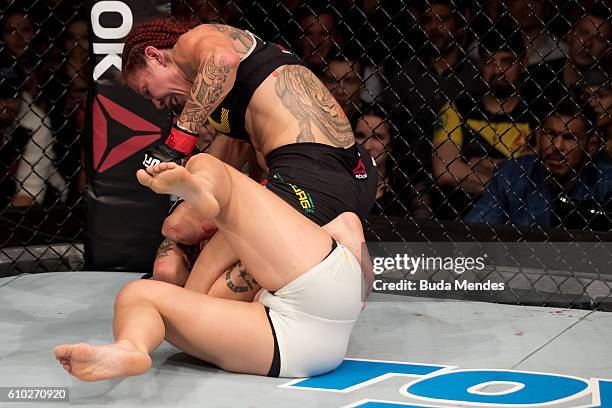 Cris Cyborg of Brazil submits Lina Lansberg of Sweden in their catchweight bout during the UFC Fight Night event at Nilson Nelson gymnasium on...