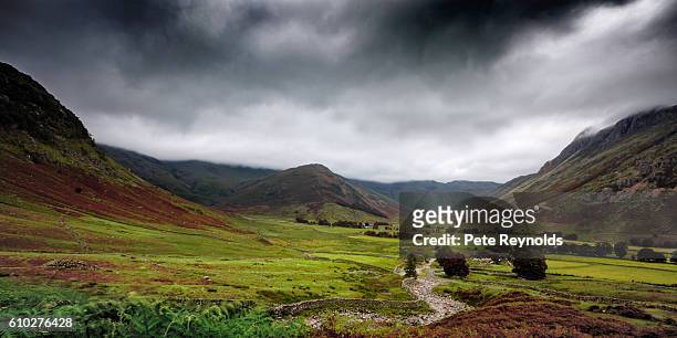 a valley and lush mountains surrounded by a storm - north west province south africa stock pictures, royalty-free photos & images