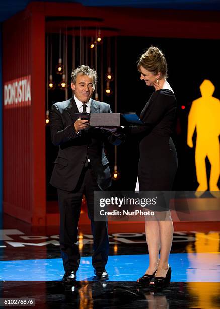 Eduard Fernandez receives the Silver Shell Award for Best Actor for the film 'El Hombre De Las Mil Caras' during the closing ceremony of the 64th San...