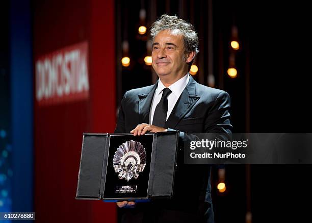 Eduard Fernandez receives the Silver Shell Award for Best Actor for the film 'El Hombre De Las Mil Caras' during the closing ceremony of the 64th San...