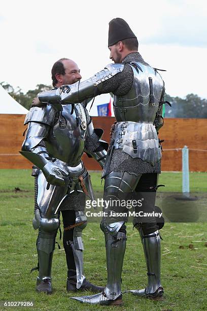 Cliff Marisma of Australia is embraced by Arne Koets of The Netherlands after winning the Jousting tournament during the Medieval Faire at St Ives...