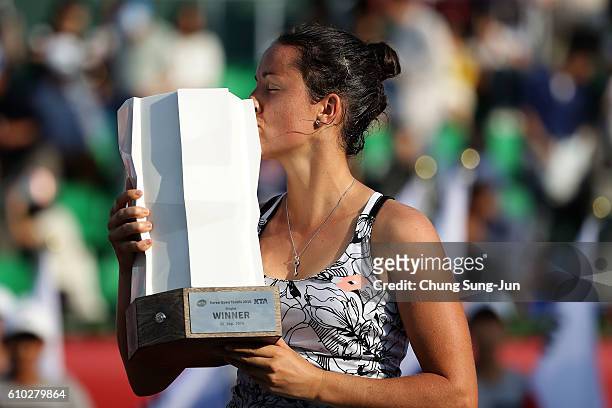 Lara Arruabarrena of Spain celebrates after defeating Monica Niculescu of Romania to win the final on final day of the Korea Open Tennis 2016 at...