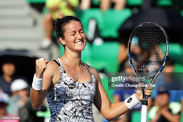 Lara Arruabarrena of Spain celebrates after defeating Monica Niculescu of Romania to win the final on final day of the Korea Open Tennis 2016 at...