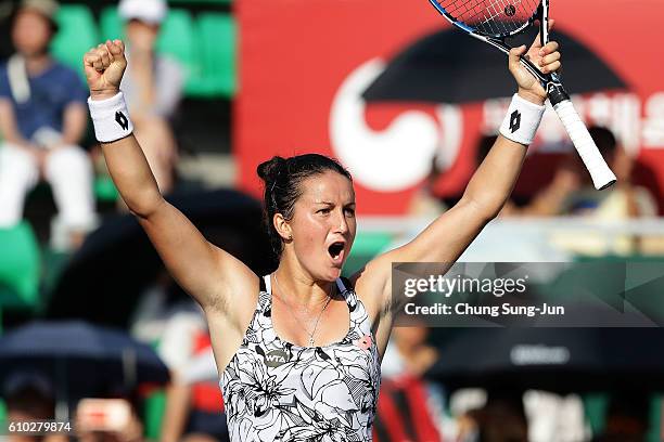 Lara Arruabarrena of Spain celebrates after defeating Monica Niculescu of Romania to win the final on final day of the Korea Open Tennis 2016 at...