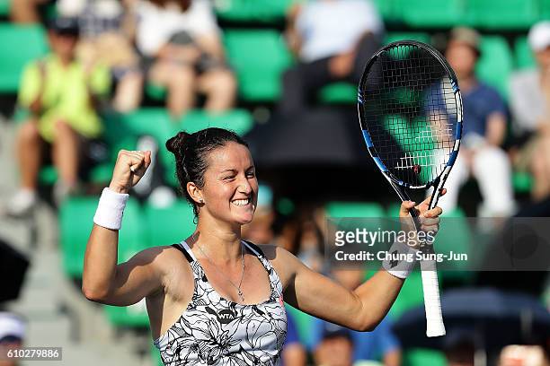 Lara Arruabarrena of Spain celebrates after defeating Monica Niculescu of Romania to win the final on final day of the Korea Open Tennis 2016 at...