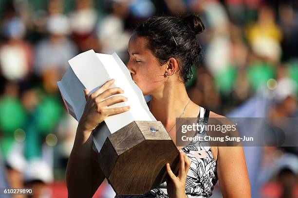 Lara Arruabarrena of Spain celebrates after defeating Monica Niculescu of Romania to win the final on final day of the Korea Open Tennis 2016 at...