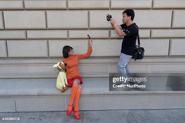 Photographer takes a picture of a cosplayer during Nerdbot Con, a convention for nerds, geeks and cosplayers in Pasadena, California. September 24,...