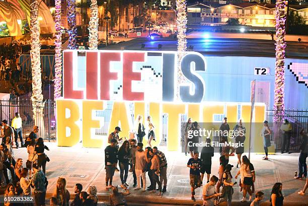 Festival goers pose in front of the 'Life is Beautiful' signage during day 2 of the Life Is Beautiful festival on September 24, 2016 in Las Vegas,...