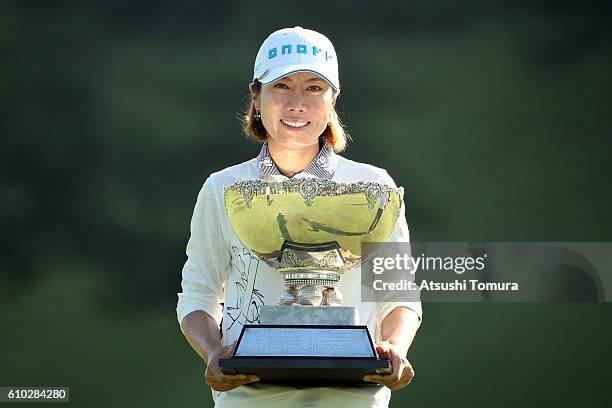 Ji-Hee Lee of South Korea poses with the trophy after winning the Miyagi TV Cup Dunlop Ladies Open 2016 at the Rifu Golf Club on September 25, 2016...