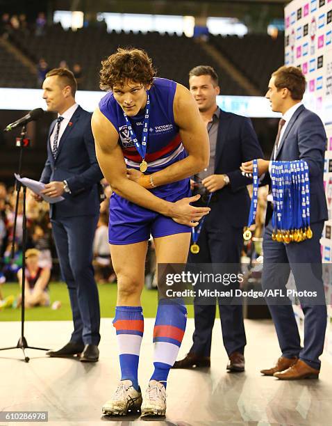 Will Minson of Footscray bows to teammates after winning during the VFL Grand Final match between the Casey Scorpions and the Footscray Bulldogs at...