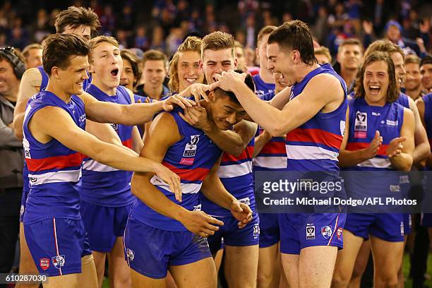 Lin Jong celebrates the winning best on ground during the VFL Grand Final match between the Casey Scorpions and the Footscray Bulldogs at Etihad...