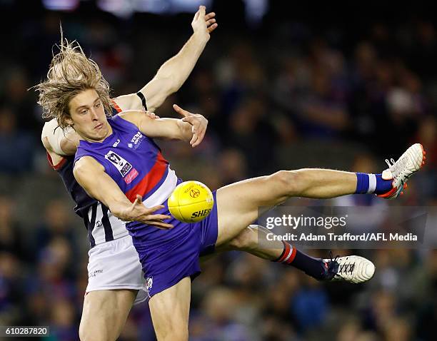 Roarke Smith of the Bulldogs and Liam Hulett of the Scorpions compete for the ball during the VFL Grand Final match between Footscray Bulldogs and...