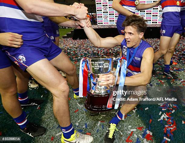 Jed Adcock of the Bulldogs gets a hand up off the ground during the VFL Grand Final match between Footscray Bulldogs and Casey Scorpions at Etihad...